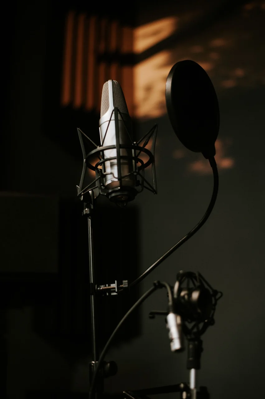 Precision studio microphone angled for vocal capture in controlled isolation
