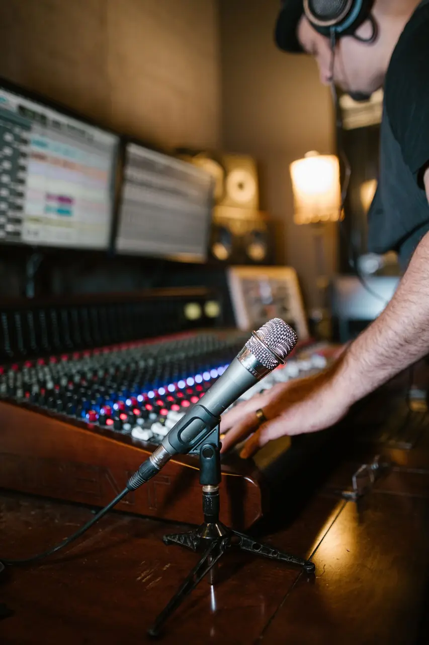 Producer composing layered instrumental arrangements at digital workstation